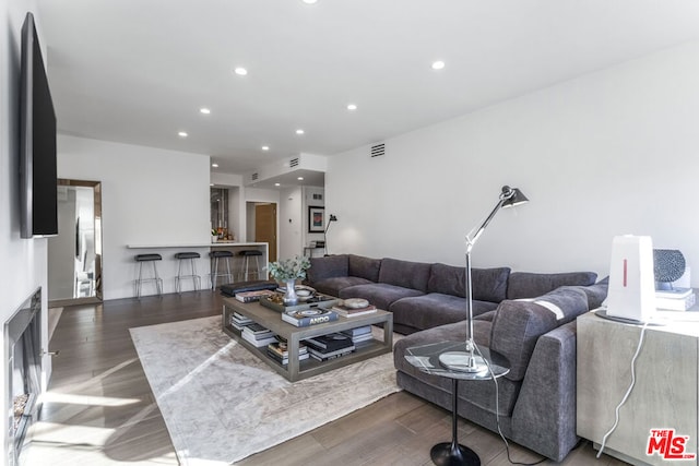 living room with dark hardwood / wood-style floors