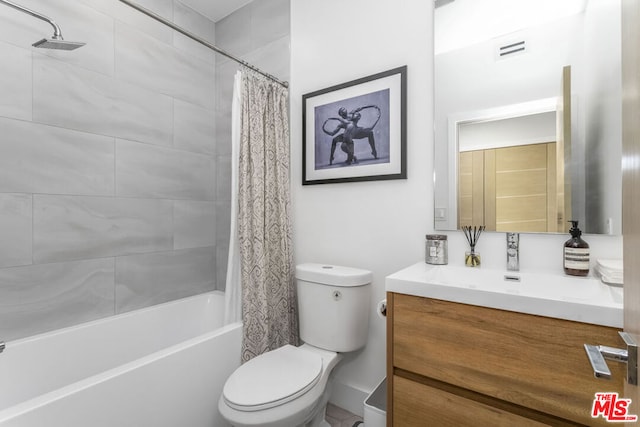 full bathroom featuring toilet, vanity, and shower / tub combo