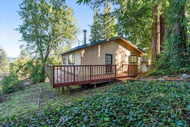 back of property with a wooden deck