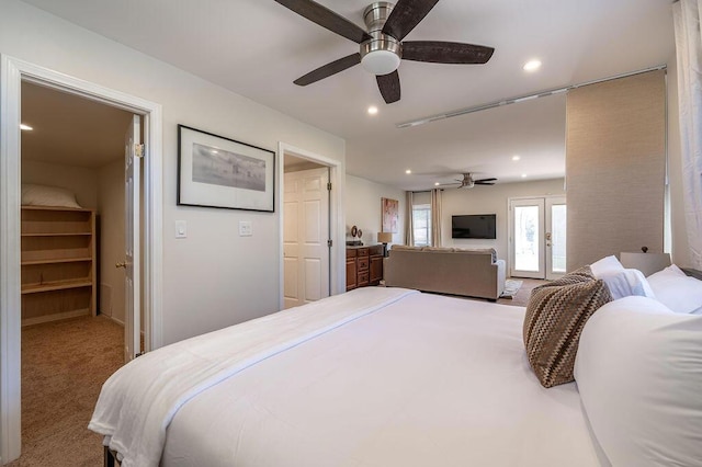 bedroom featuring ceiling fan, carpet flooring, and french doors