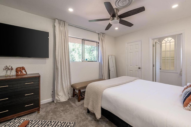 carpeted bedroom with ceiling fan