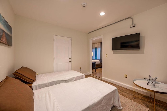 bedroom featuring hardwood / wood-style flooring