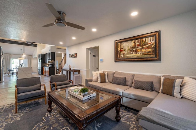 living room with ceiling fan and parquet floors