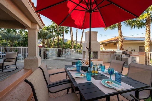 view of patio / terrace featuring grilling area and an outdoor kitchen