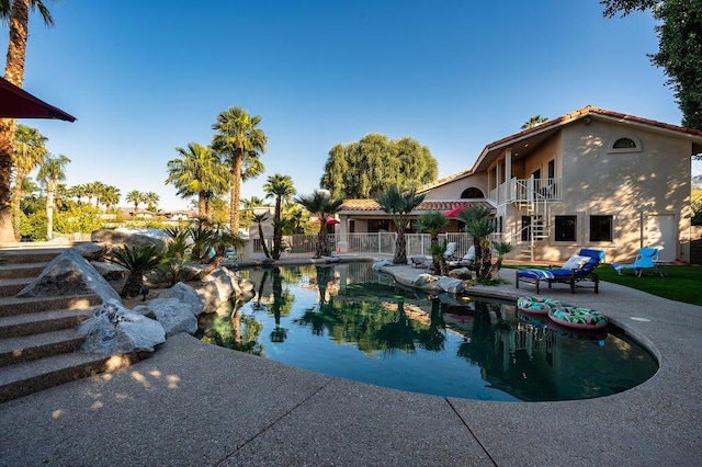 view of swimming pool with a patio