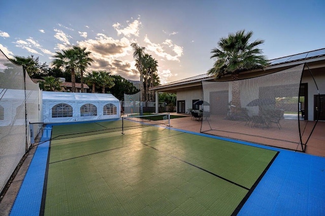 view of basketball court with tennis court