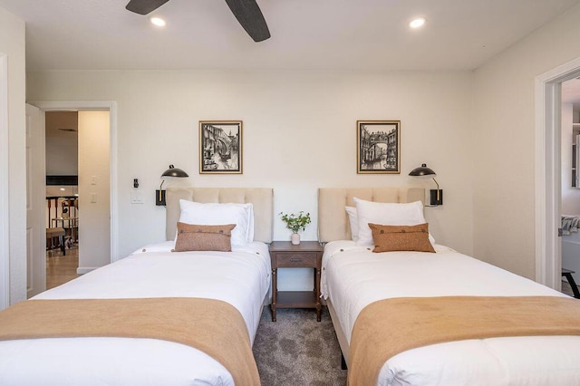 bedroom with ceiling fan and carpet flooring