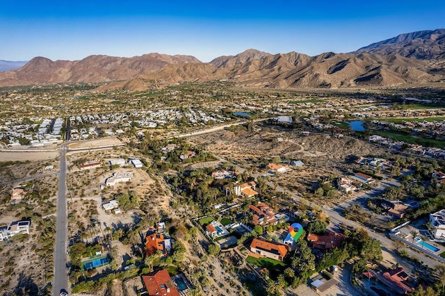 birds eye view of property with a mountain view