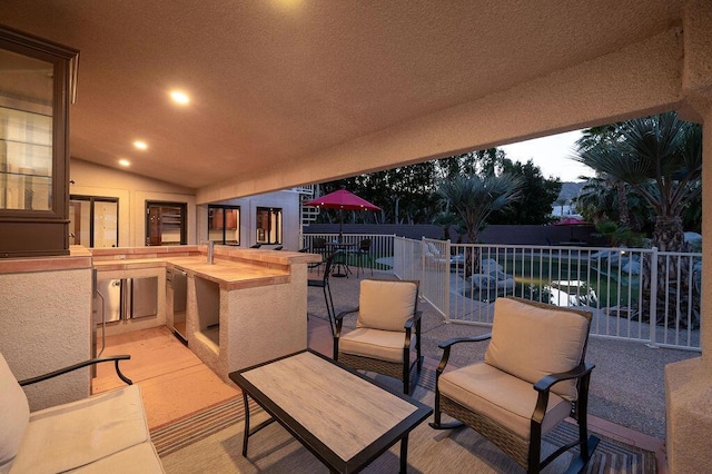 view of patio terrace at dusk