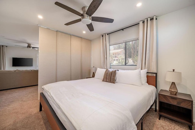 carpeted bedroom featuring ceiling fan