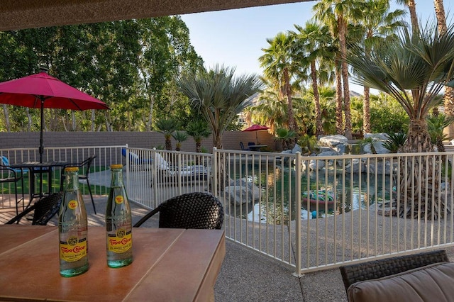 view of swimming pool with a water view