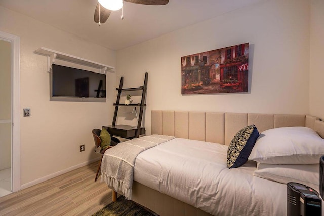 bedroom with ceiling fan and wood-type flooring