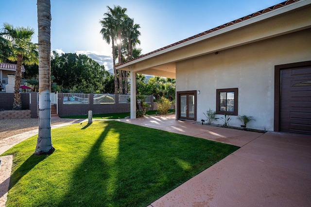 view of yard with french doors