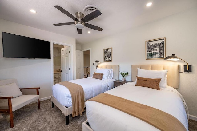 carpeted bedroom with ceiling fan and ensuite bathroom