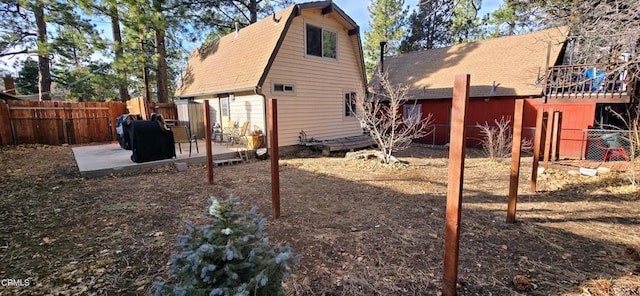 back of property featuring a patio