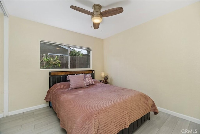 bedroom featuring ceiling fan and light hardwood / wood-style flooring