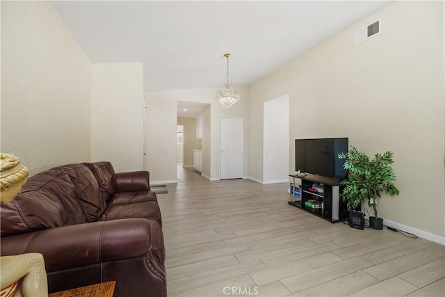 living room featuring light hardwood / wood-style floors and a chandelier