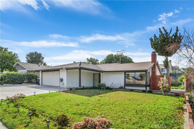 single story home with a front lawn and a garage