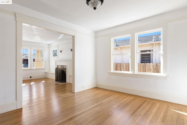 unfurnished living room featuring hardwood / wood-style flooring