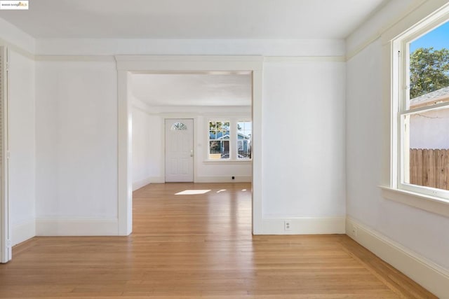 spare room featuring light hardwood / wood-style flooring