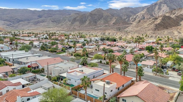 birds eye view of property with a mountain view