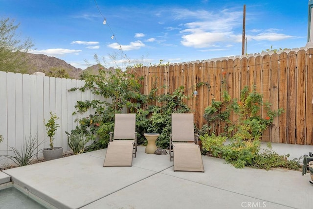 view of patio featuring a mountain view