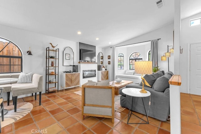 tiled living room featuring lofted ceiling