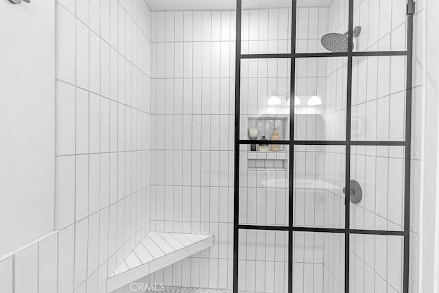 bathroom with tiled shower