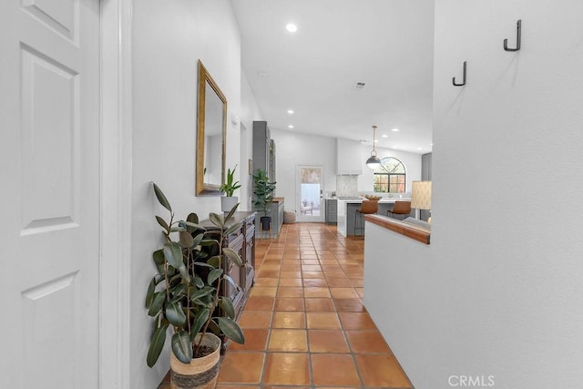 hallway with tile patterned floors