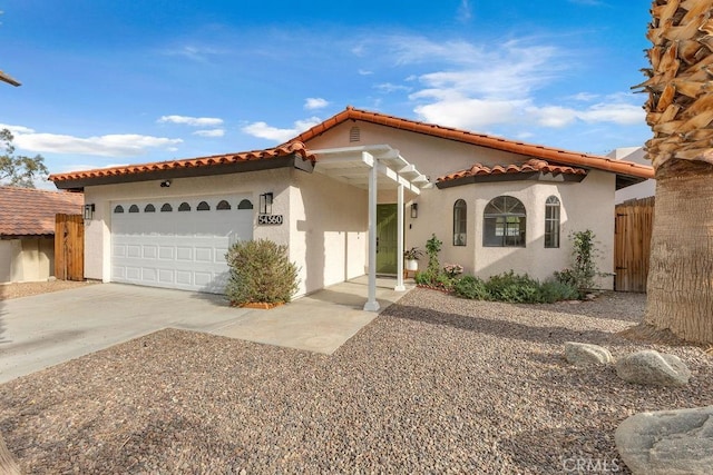 mediterranean / spanish-style house featuring a garage