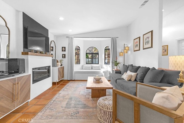 tiled living room with lofted ceiling