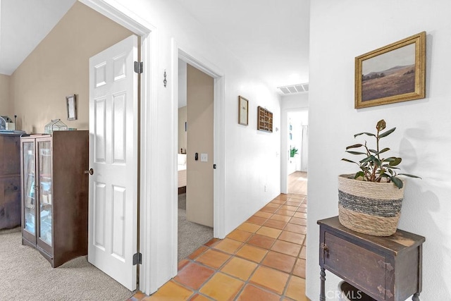 hall with tile patterned flooring