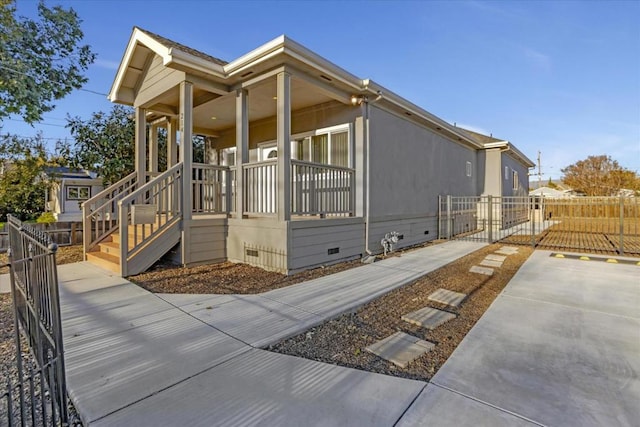 view of property exterior with a porch