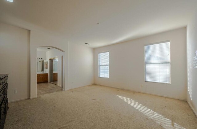 interior space featuring light colored carpet