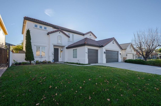 mediterranean / spanish home with a front lawn and a garage