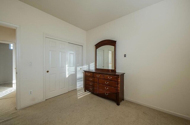 carpeted bedroom featuring a closet