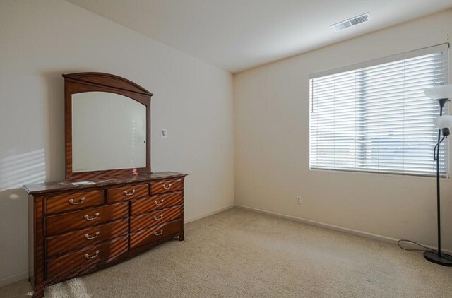 bedroom with light carpet