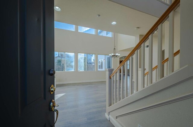 foyer featuring a chandelier and hardwood / wood-style flooring