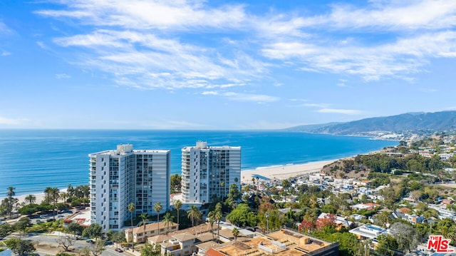 bird's eye view featuring a water and mountain view and a view of the beach