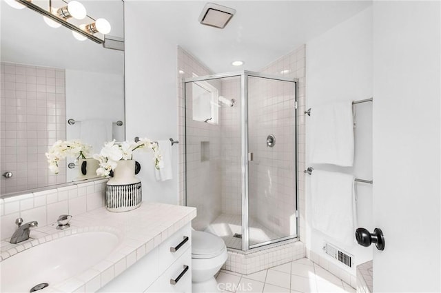 bathroom featuring toilet, tile patterned flooring, an enclosed shower, and sink