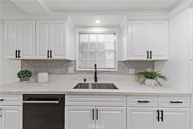 kitchen with white cabinetry, backsplash, dishwasher, light stone countertops, and sink