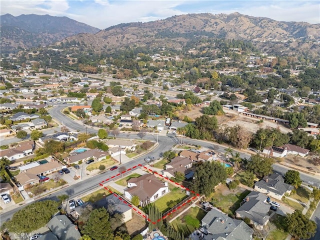 birds eye view of property featuring a mountain view