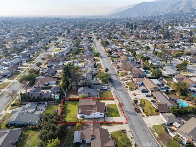 birds eye view of property featuring a mountain view