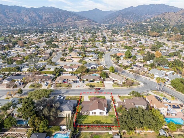 birds eye view of property with a mountain view