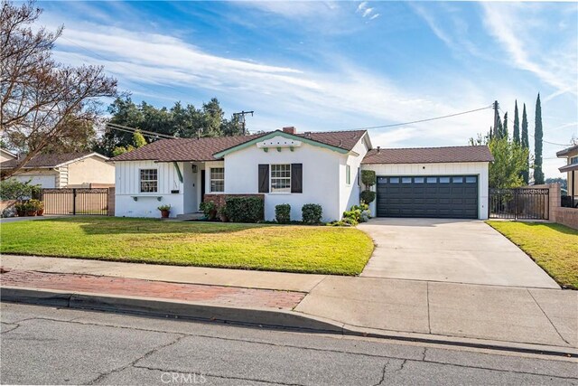 single story home with a front lawn and a garage