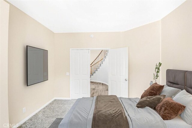 bedroom featuring carpet