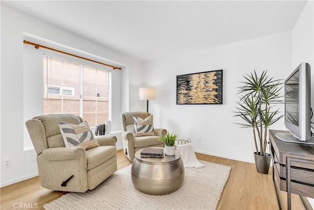 living area with light hardwood / wood-style flooring