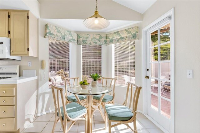 dining space featuring light tile patterned floors