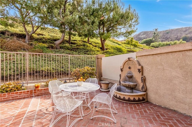 view of patio featuring a mountain view