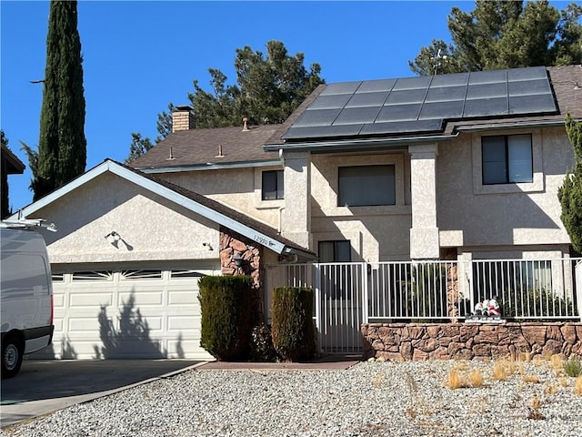 exterior space featuring solar panels and a garage